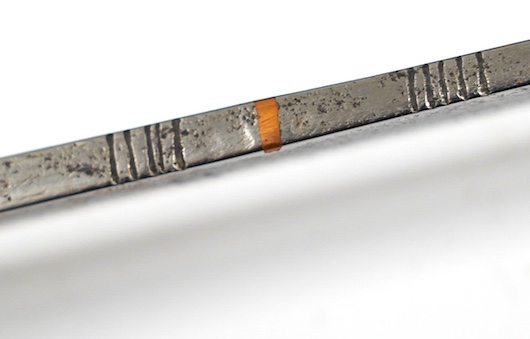 A Thai sword Dha, with a lacquered hilt and wooden scabbard, blade 56cm. Condition - fair